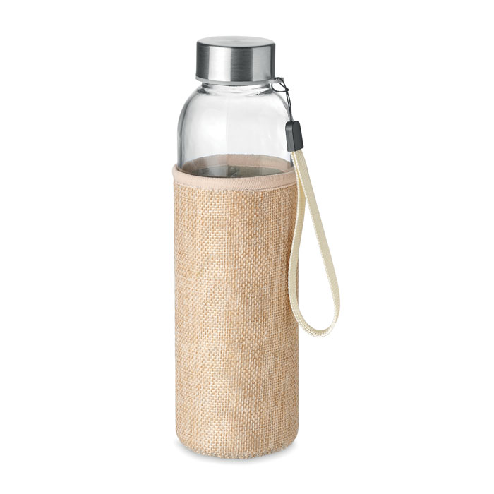 Szklana butelka w etui 500ml Szklana butelka z neoprenowym etui z mieszanki jutowej. Pojemność: 500 ml. Nie nadaje się do napojów gazowanych. Szczelna.