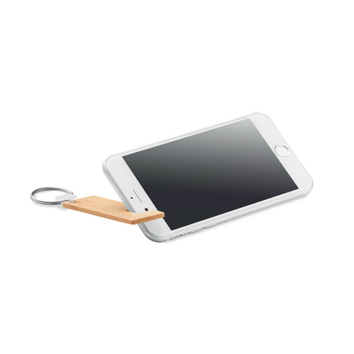 Bambusowy brelok z podstawką Bambusowy brelok do kluczy z funkcją podstawki pod telefon. Bambus jest produktem naturalnym, dlatego mogą wystąpić nieznaczne różnice w kolorze, wzorze i rozmiarze.